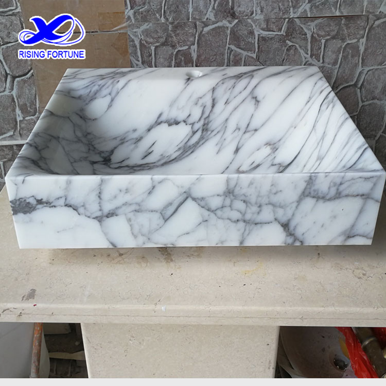 white marble wash basin