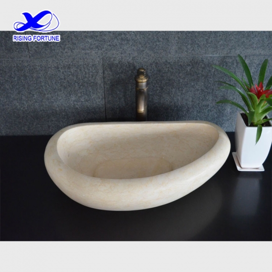 Oval beige marble counter top basin
